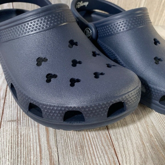 white crocs with mickey mouse holes